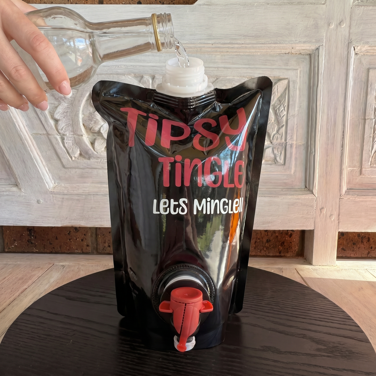 pouring soda water into the pre-mixed bag