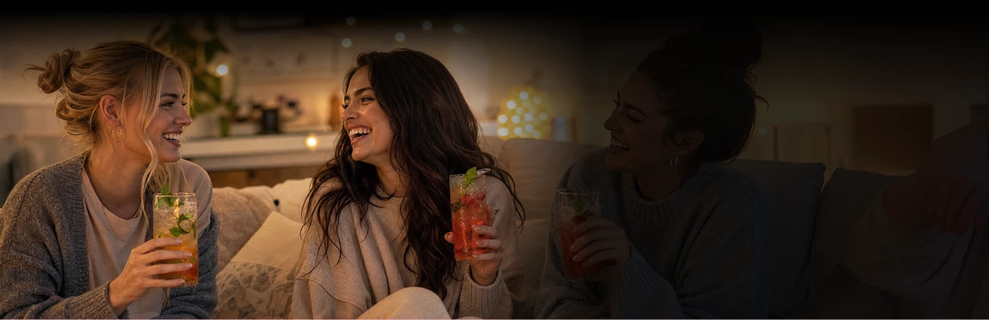 people enjoying drinks together in a cozy setting